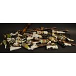 A collection of 19th century German porcelain pipes, various subjects,