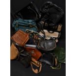 A quantity of leather handbags, mostly new and unused,