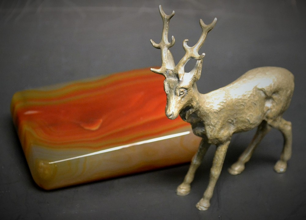 An early 20th century silvered desk model, of a stag,