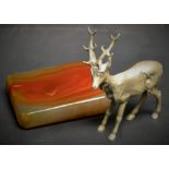 An early 20th century silvered desk model, of a stag,