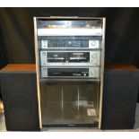 A Sanyo stereo system, comprising turntable, TP250, amplifier, JA350A, casette deck, RDW360A, tuner,