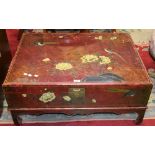 An Oriental style chest on stand, decorated throughout with birds and blossoming prunus,