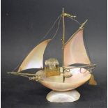 A 19th century souvenir mother of pearl novelty inkstand, as a sailing boat,