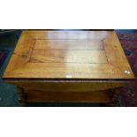 An oak elliptical dropleaf coffee table,