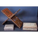 An Indian Islamic lacquered Koran stand, decorated with geometric motifs, 34cm wide,