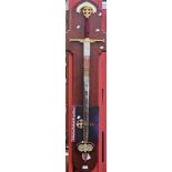 A decorative sword, The Columbus, mounted on mahogany presentation board,