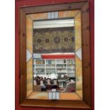 A large decorative wall mirror, Tiffany style leaded border, pine frame,