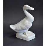 A Chinese Blanc de Chine model, of a goose, naturalistically modelled, shaped base, 15cm high,