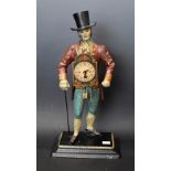 A reproduction cast iron figural clock, gentleman walking with cane and hat, approx 40.