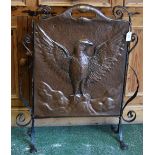 An Arts and Crafts beaten copper and wrought iron fire screen,