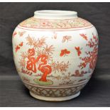 A large Chinese ovoid vase, decorated in red and green with pine trees and insects, 24cm high,