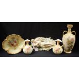 A late Victorian Staffordshire blush ivory two handled vase; a pair of similar smaller ovoid vases;