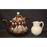 A Victorian Bargeware teapot, relief decorated with pheasants and foliage,