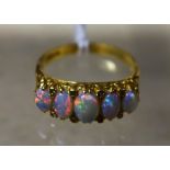 An 18ct gold five stone opal and diamond ring,