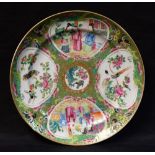 A Chinese Cantonese circular plate, decorated with four panels of birds, foliage and figures,