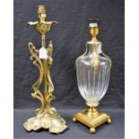 An Art Nouveau style brass table lamp, cast with sinuous stems, leafy trefoil base,