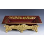 A 19th century giltwood and gesso table trough, carved and moulded with scrolling acanthus,