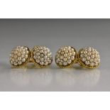 A pair of seed pearl mounted domed circular cufflinks, rope twist rims, yellow metal bodies,