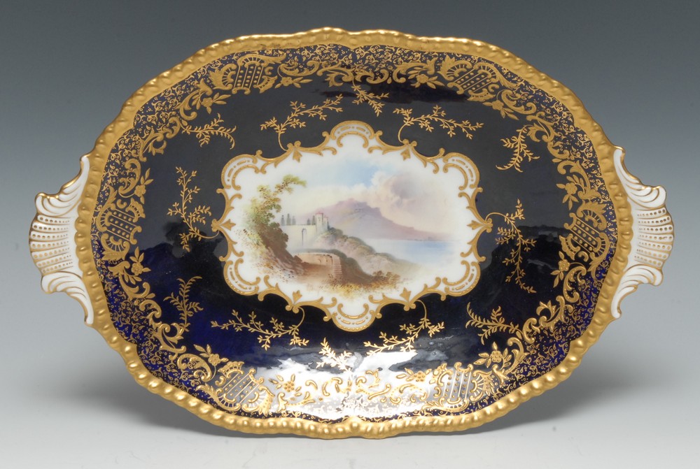 A Coalport Named View shaped oval two handled dish, painted by A.