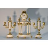 A Louis XVI style gilt metal mounted marble clock garniture,