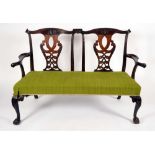 An Irish Chippendale design mahogany chair back sofa, cupid bow cresting rails,