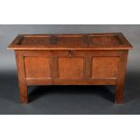 An 18th Century oak three panel blanket chest, hinged top, stile feet, 70cm high, 125cm wide, c.