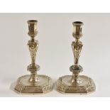 A pair of 18th century Dutch silver canted square table candlesticks, of seamed construction,