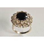 An 18ct gold sapphire and diamond cluster ring,