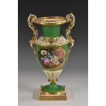 An English porcelain pedestal two handled vase,