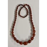 A string of amber graduated butterscotch beads,