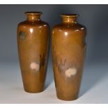 A pair of Japanese bronze ovoid vases,