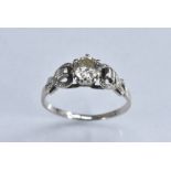 A diamond solitaire ring, round brilliant cut, measuring approx 5.5mm x 3.