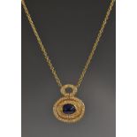 A diamond and cabochon blue sapphire pendant necklace,