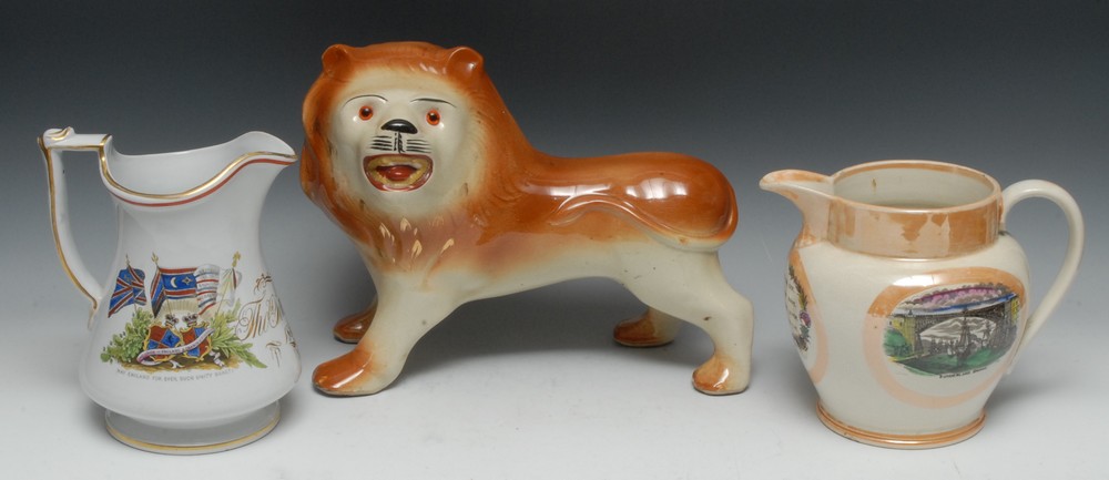 A Victorian Staffordshire lion, standing to the right, glass eyes, coloured in brown, 27cm high, c.