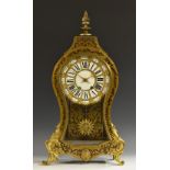 A Napoleon III gilt metal mounted 'boulle' cartouche shaped mantel clock,