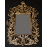 An 18th century Baroque giltwood and gesso looking-glass,