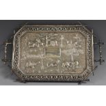 An Indian silver canted rectangular tray, the field chased with elephants,