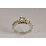 A diamond solitaire ring, raised round brilliant cut diamond approx 0.