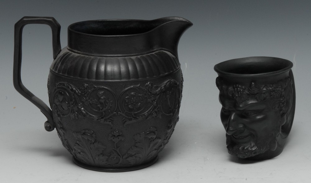 A Wedgwood black basalt Bacchus cup, with vine chaplet, 10cm high, a similar black basalt jug,