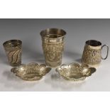 An Indian silver tapered cylindrical beaker, chased with a band of deities on a textured ground,