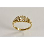 A Victorian seven stone diamond ring, linear set with a central old cushion cut diamond, approx 0.