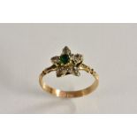 A diamond and emerald six stone flowerhead cluster ring, yellow metal shank, size L, 1.