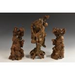 A pair of 19th century Chinese hardwood carvings, of emaciated elders,