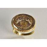 An unusual 18th century hair and gold wire work mourning ring,