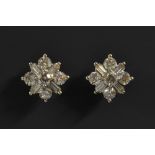 A pair of diamond cluster earrings, each inset with five round cut and four trapezoid diamonds,