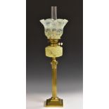 A 19th century vaseline glass and gilt-brass oil lamp, wavy shade, marbled glass reservoir,