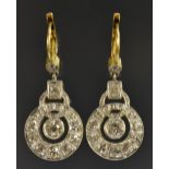 A pair of diamond graduated ring drop earrings,