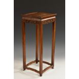 A Chinese hardwood vase stand, square panelled top above a pierced frieze,