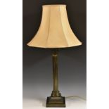 An early 20th century brown patinated Corinthian table lamp,