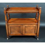 A Victorian mahogany buffet, the two tiers with three quarter galleries, turned pillars and finials,